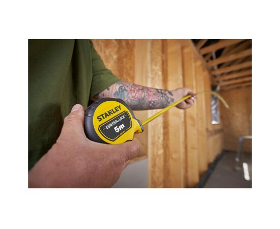 Рулетка Stanley CONTROL-LOCK, 5мх25мм, у прогумованому корпусі, з двосторонньою шкалою (STHT37231-0), зображення 9 Рулетка Stanley CONTROL-LOCK, 5мх25мм, у прогумованому корпусі, з двосторонньою шкалою (STHT37231-0), зображення 9